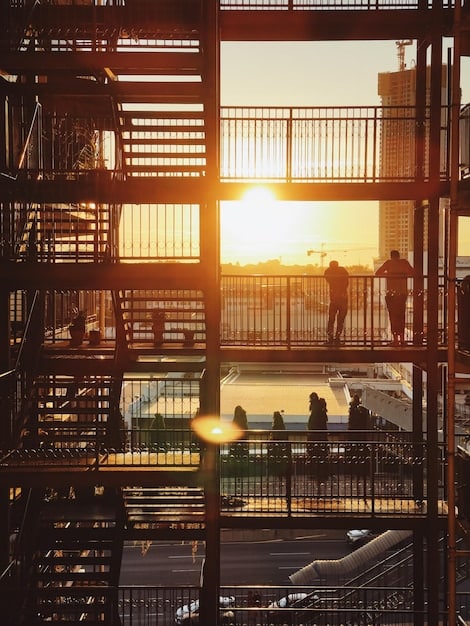 A bustling construction site with workers from various backgrounds collaborating on a significant infrastructure project, such as a railway line or a power plant. The image should convey a sense of international cooperation and development.