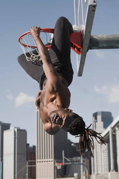 A close-up action shot of an NBA player attempting a layup, with a defender reaching in to foul him, encapsulating the transition foul dilemma and the potential rule changes to address it.