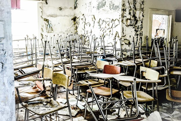 A photo of a school auditorium with outdated equipment and visible disrepair. The image conveys a sense of neglect and underfunding in the arts program.