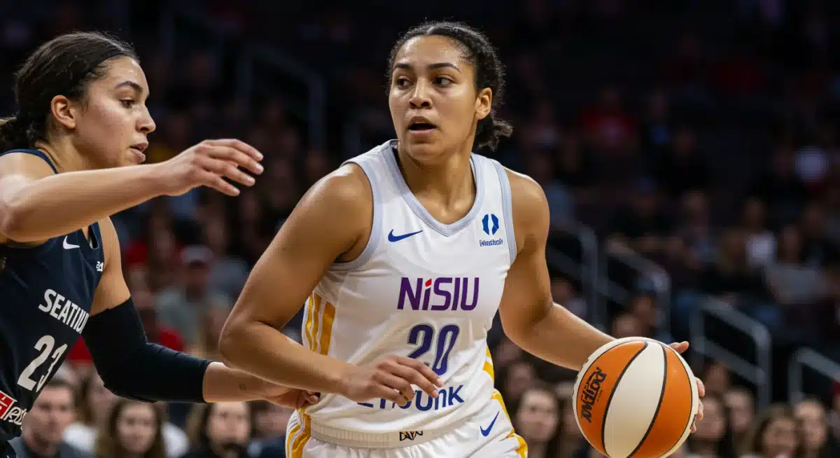 WNBA rookie driving to the basket during a pre-season game, showcasing intense focus.